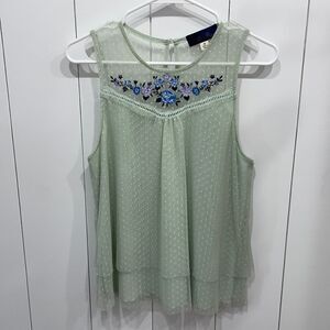 Light green blouse with floral embroidery accent